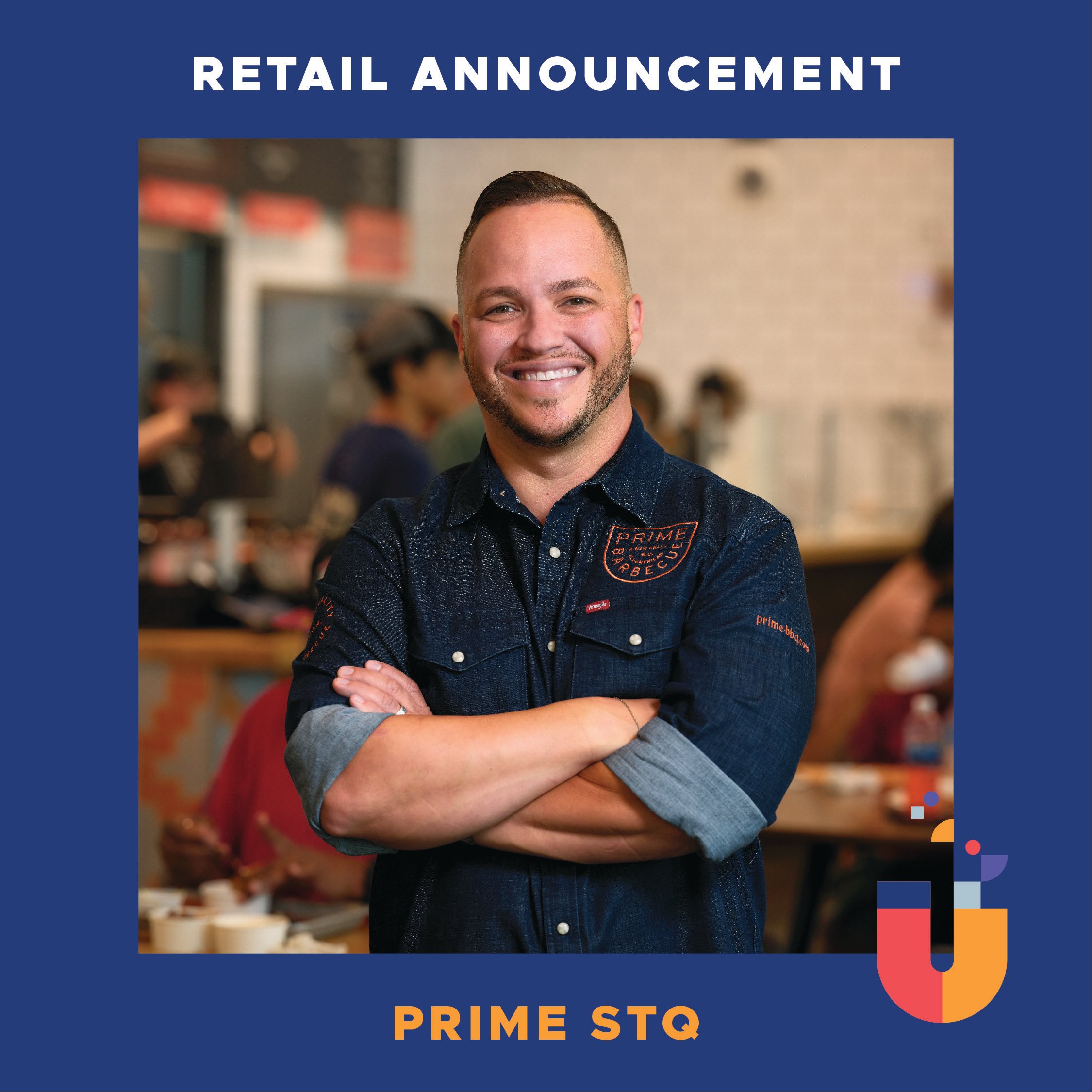 Christopher Prieto, Prime Barbecue's award-winning pitmaster, stands smiling confidently with his arms crossed inside of his restaurant.